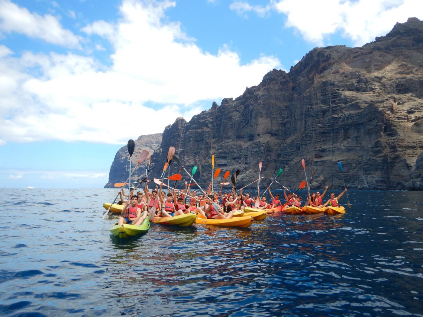 Group of people kayaking in Tenerife - Cliff of Los Gigantes