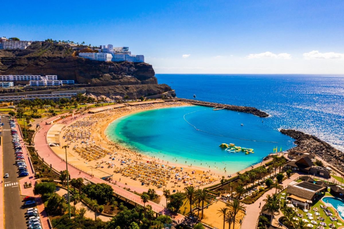 Amadores beach in a sheltered bay, pale sand and turquoise water