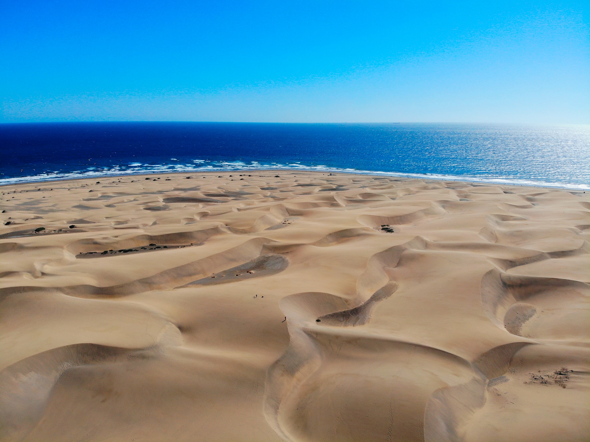 Aerial view of the Maspalomas dunes with the Atlantic beyond